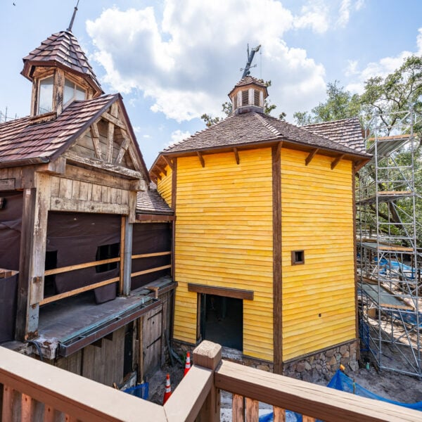 Scaffolding Removed from Bright Yellow Entrance Barn for Tiana’s Bayou Adventure at Magic Kingdom